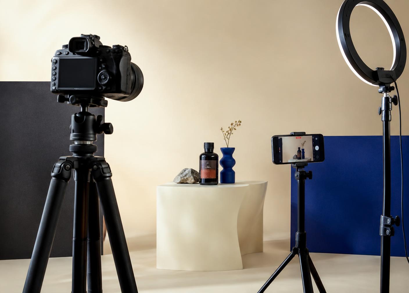 Content production equipment: camera, ring light and smartphone filming a styled scene